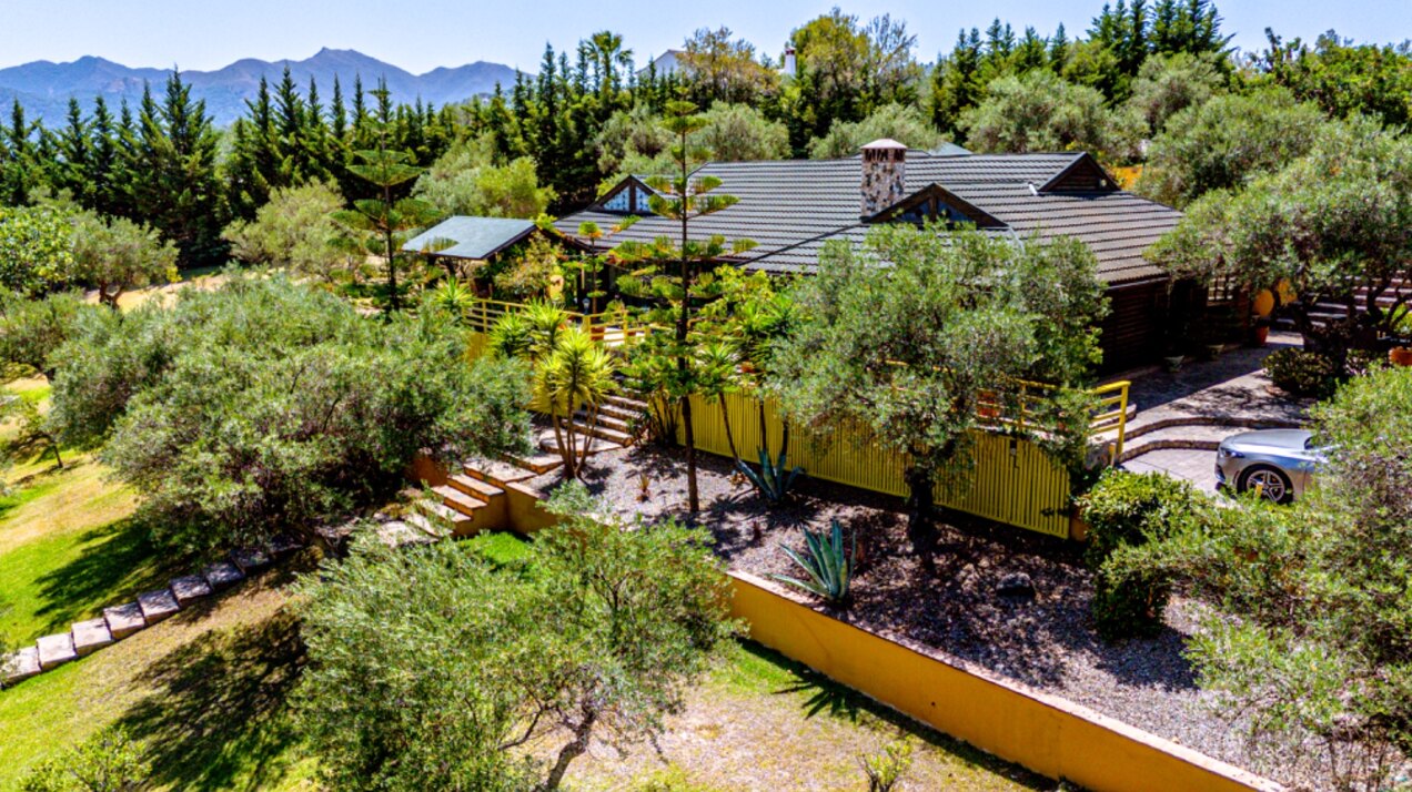 Stunning wooden country finca sits on the outskirts of Monda and its historic castle