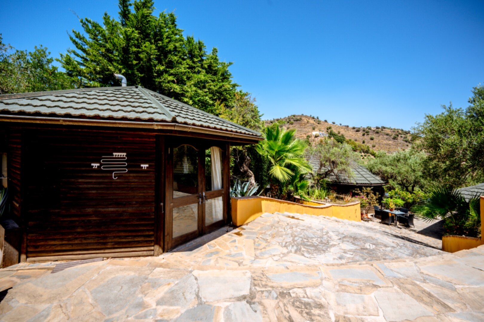 Stunning wooden country finca sits on the outskirts of Monda and its historic castle