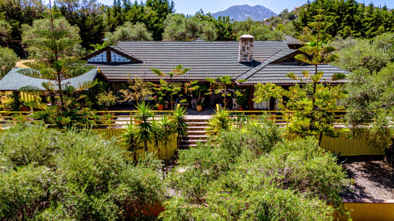 Stunning wooden country finca sits on the outskirts of Monda and its historic castle