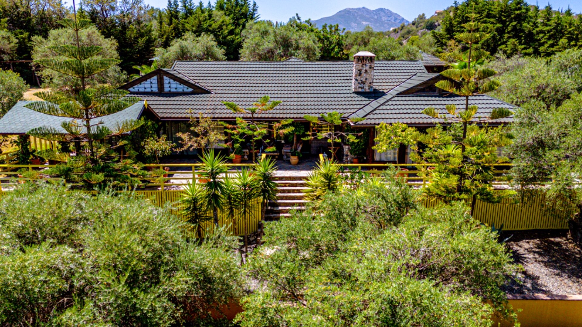 Stunning wooden country finca sits on the outskirts of Monda and its historic castle
