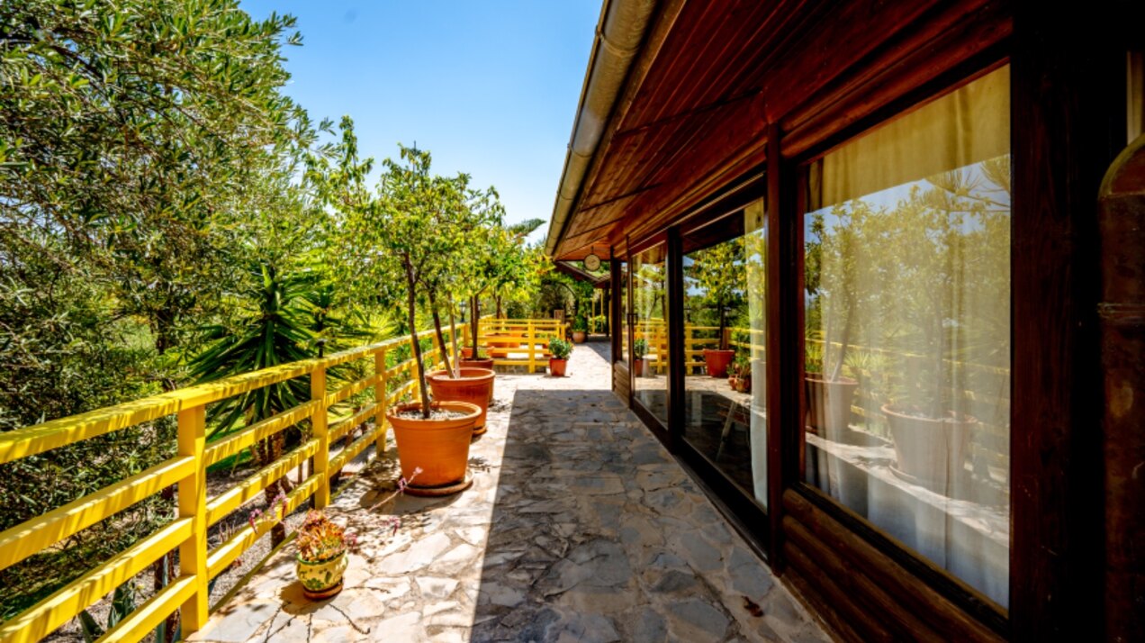 Stunning wooden country finca sits on the outskirts of Monda and its historic castle