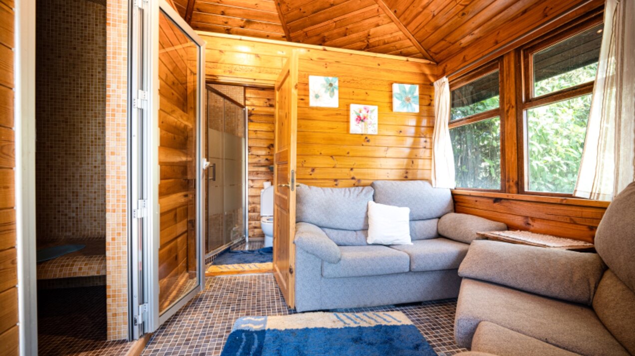 Stunning wooden country finca sits on the outskirts of Monda and its historic castle