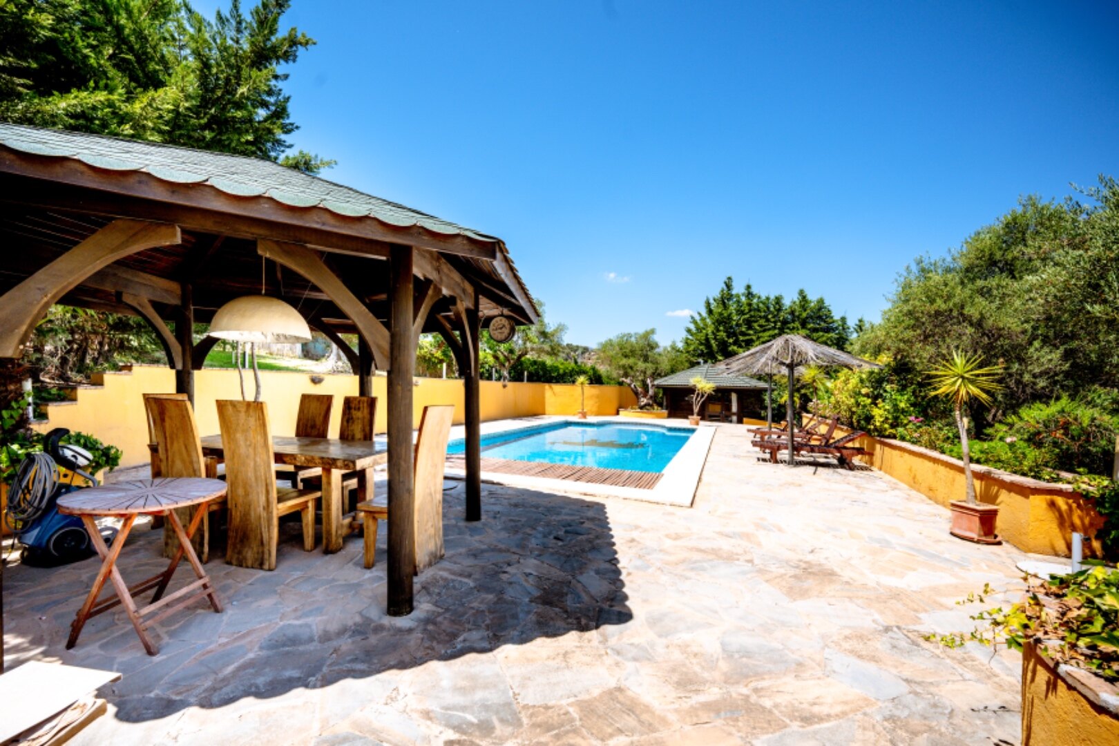 Stunning wooden country finca sits on the outskirts of Monda and its historic castle
