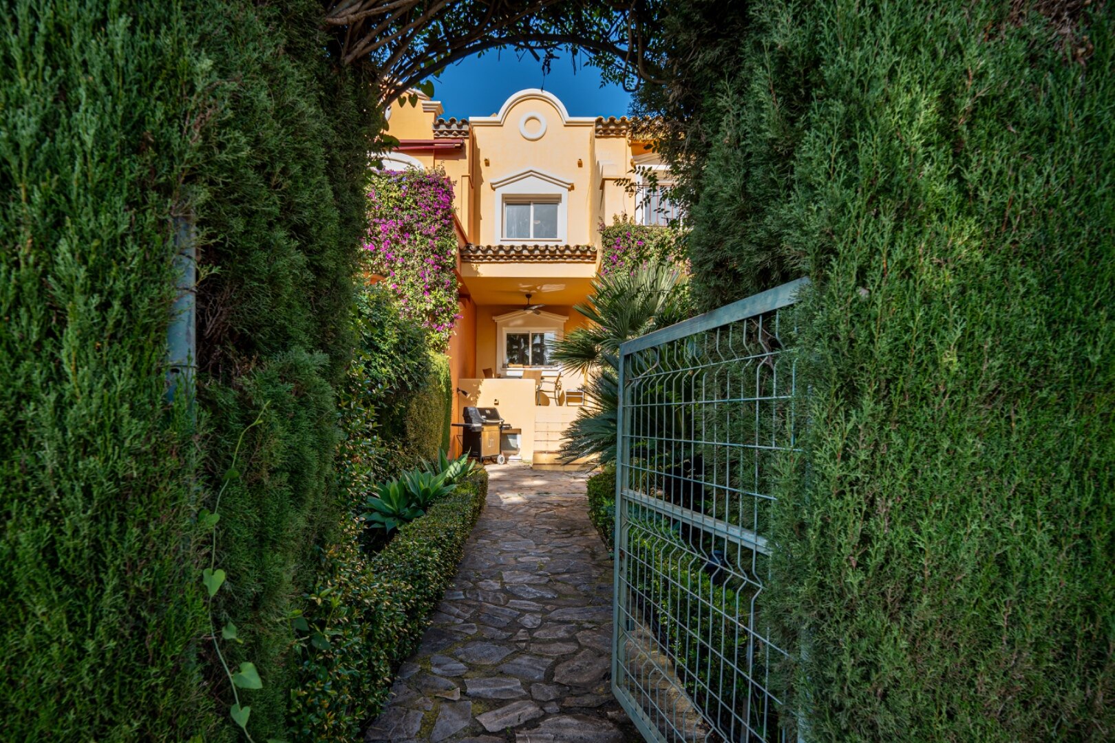 Stately 4 bedroom townhouse in quiet leafy streets in a renowned gated community is chic & welcoming