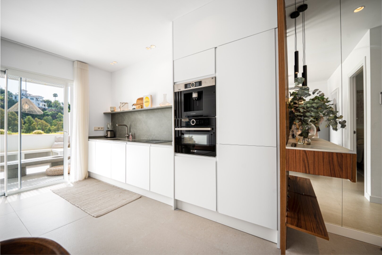 Stunning modern and luxurious apartment overlooks golf course and green valleys in Benahavis