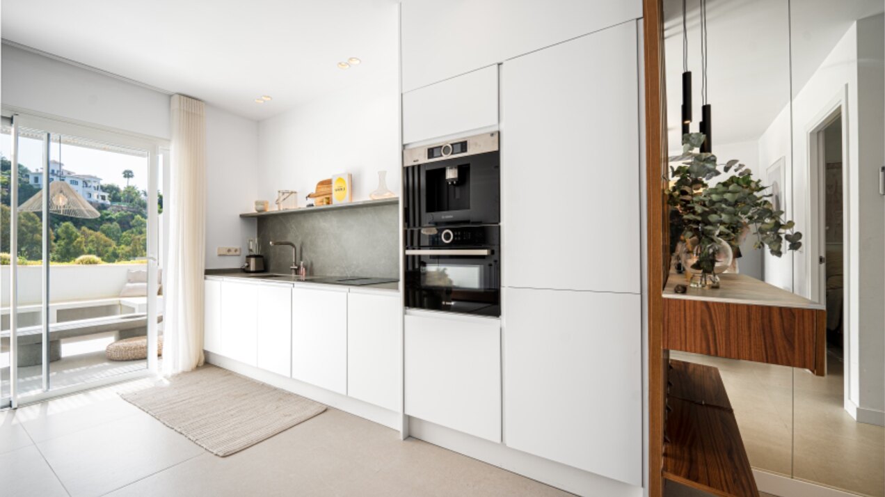Stunning modern and luxurious apartment overlooks golf course and green valleys in Benahavis