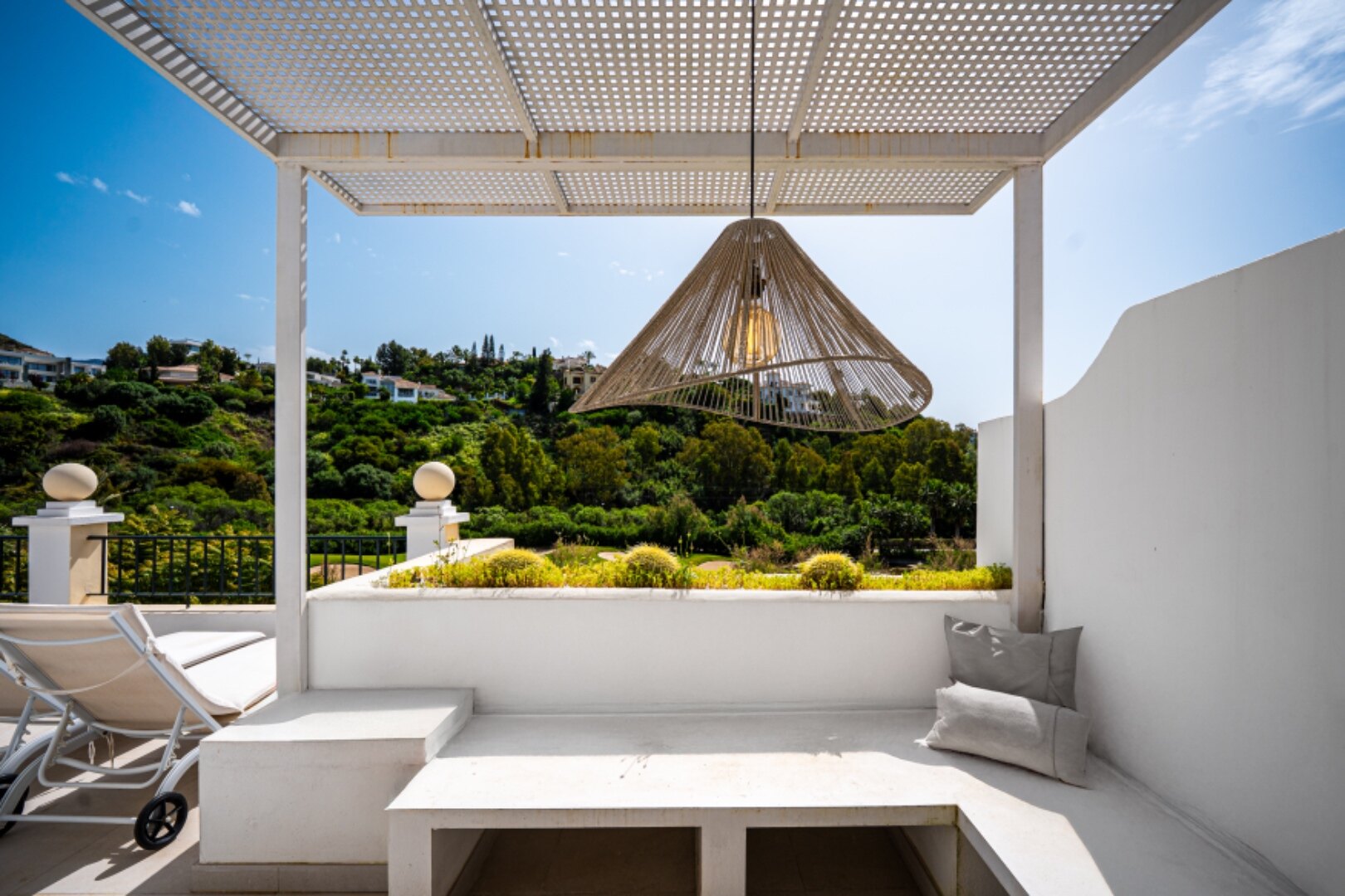 Stunning modern and luxurious apartment overlooks golf course and green valleys in Benahavis