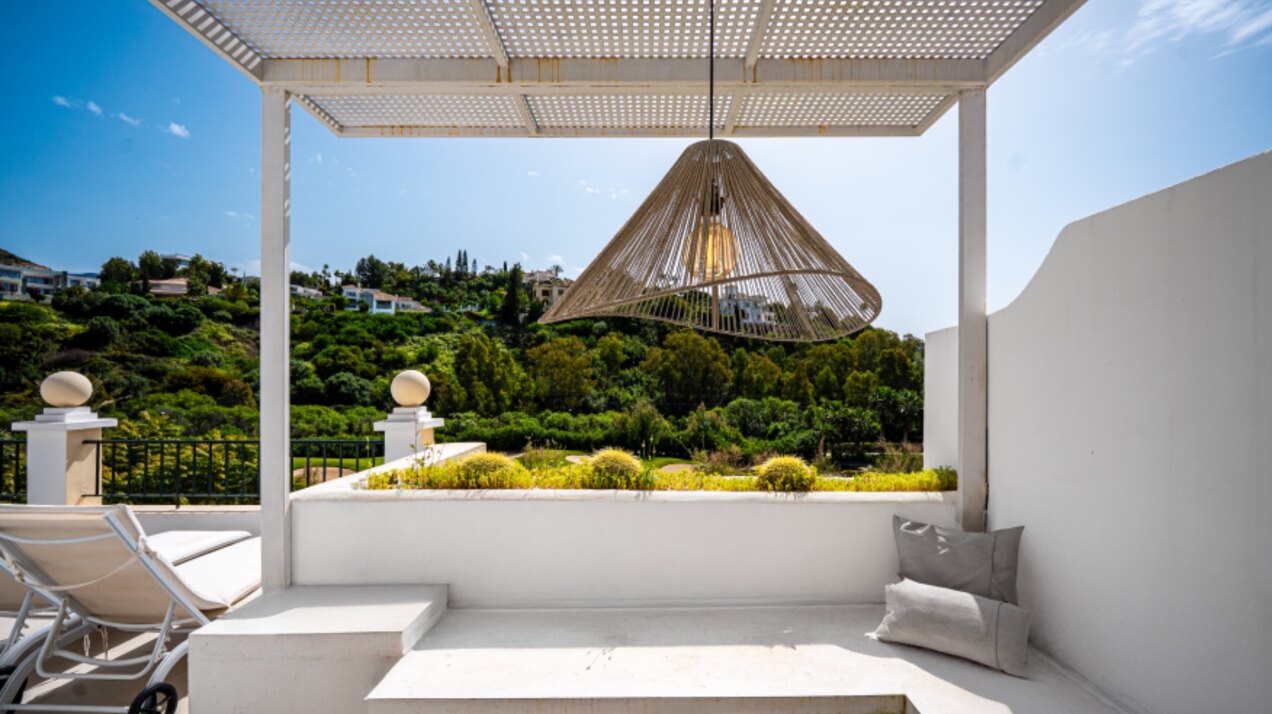 Stunning modern and luxurious apartment overlooks golf course and green valleys in Benahavis