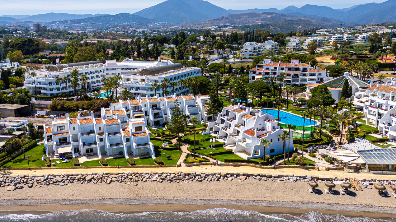 Exceptional beachfront townhouse offers the ultimate coastal lifestyle with uninterrupted sea views