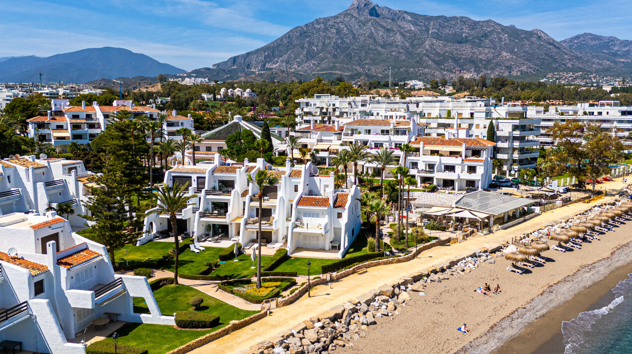 Exceptional beachfront townhouse offers the ultimate coastal lifestyle with uninterrupted sea views