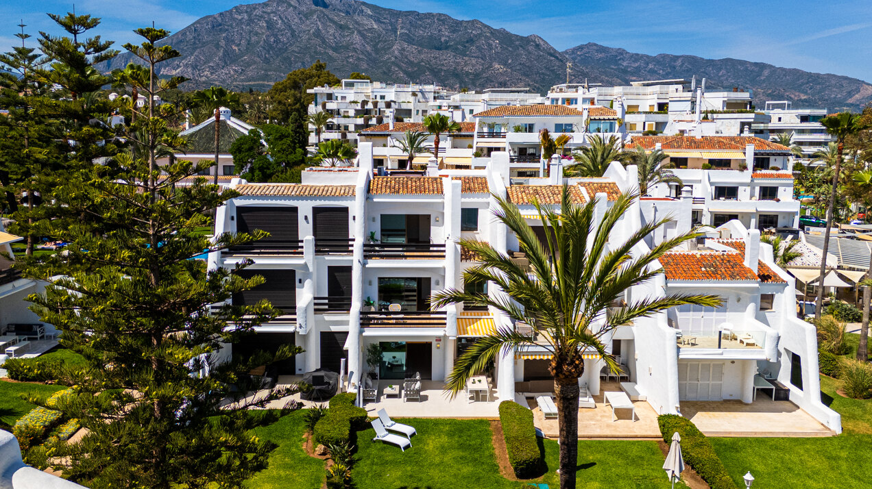 Exceptional beachfront townhouse offers the ultimate coastal lifestyle with uninterrupted sea views