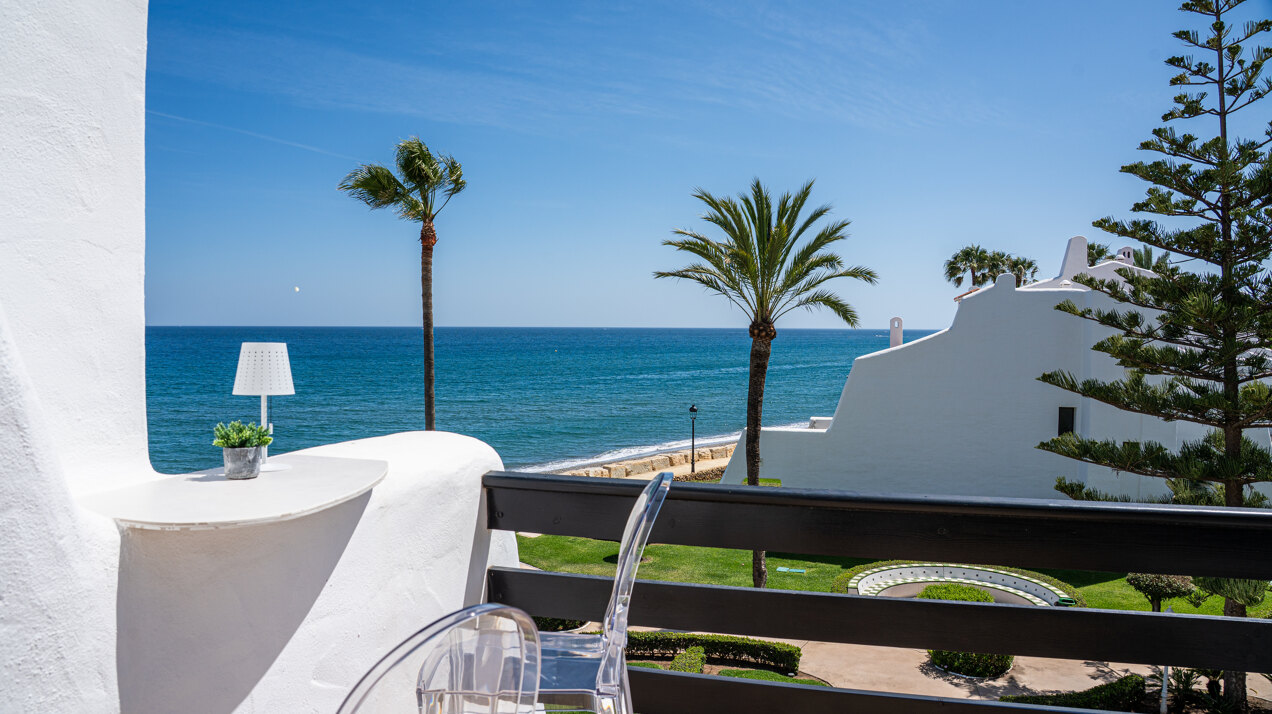 Exceptional beachfront townhouse offers the ultimate coastal lifestyle with uninterrupted sea views