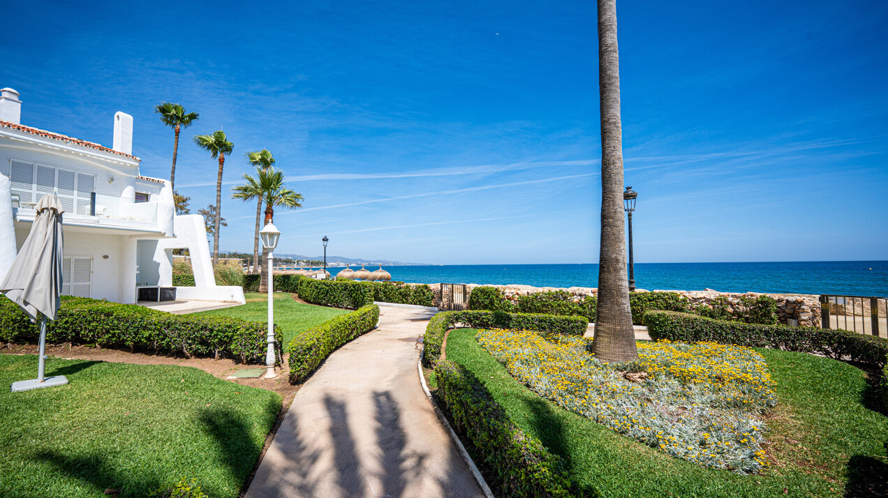 Exceptional beachfront townhouse offers the ultimate coastal lifestyle with uninterrupted sea views