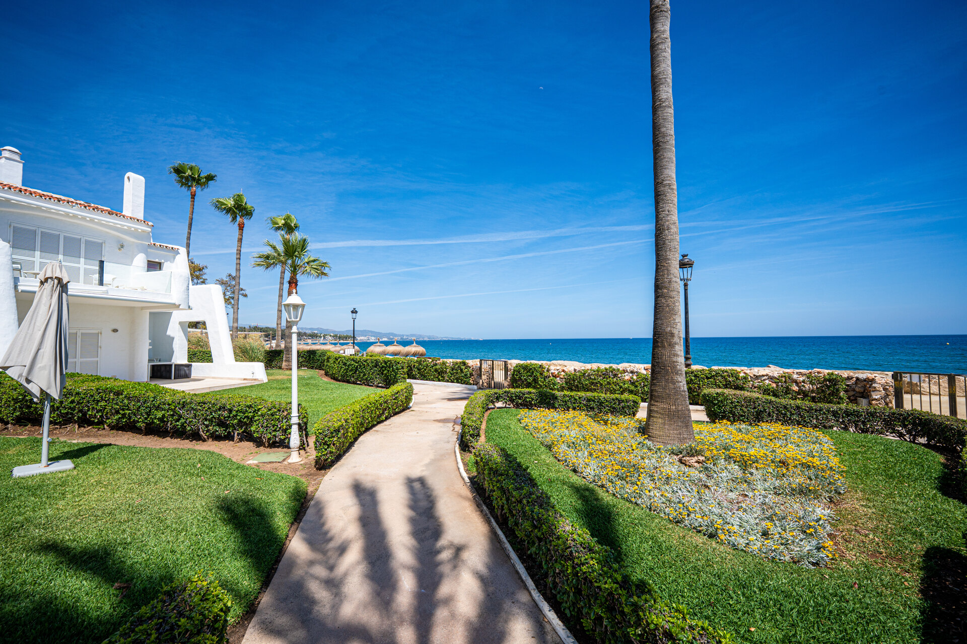 Exceptional beachfront townhouse offers the ultimate coastal lifestyle with uninterrupted sea views