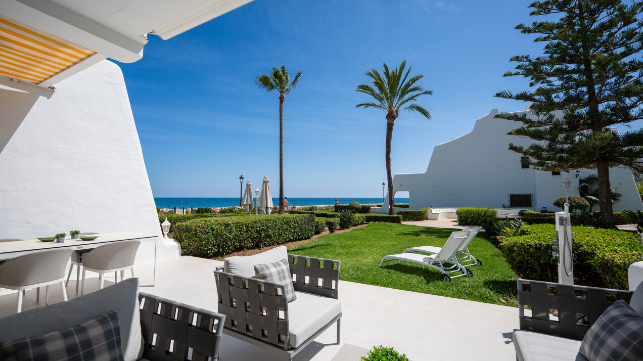 Exceptional beachfront townhouse offers the ultimate coastal lifestyle with uninterrupted sea views