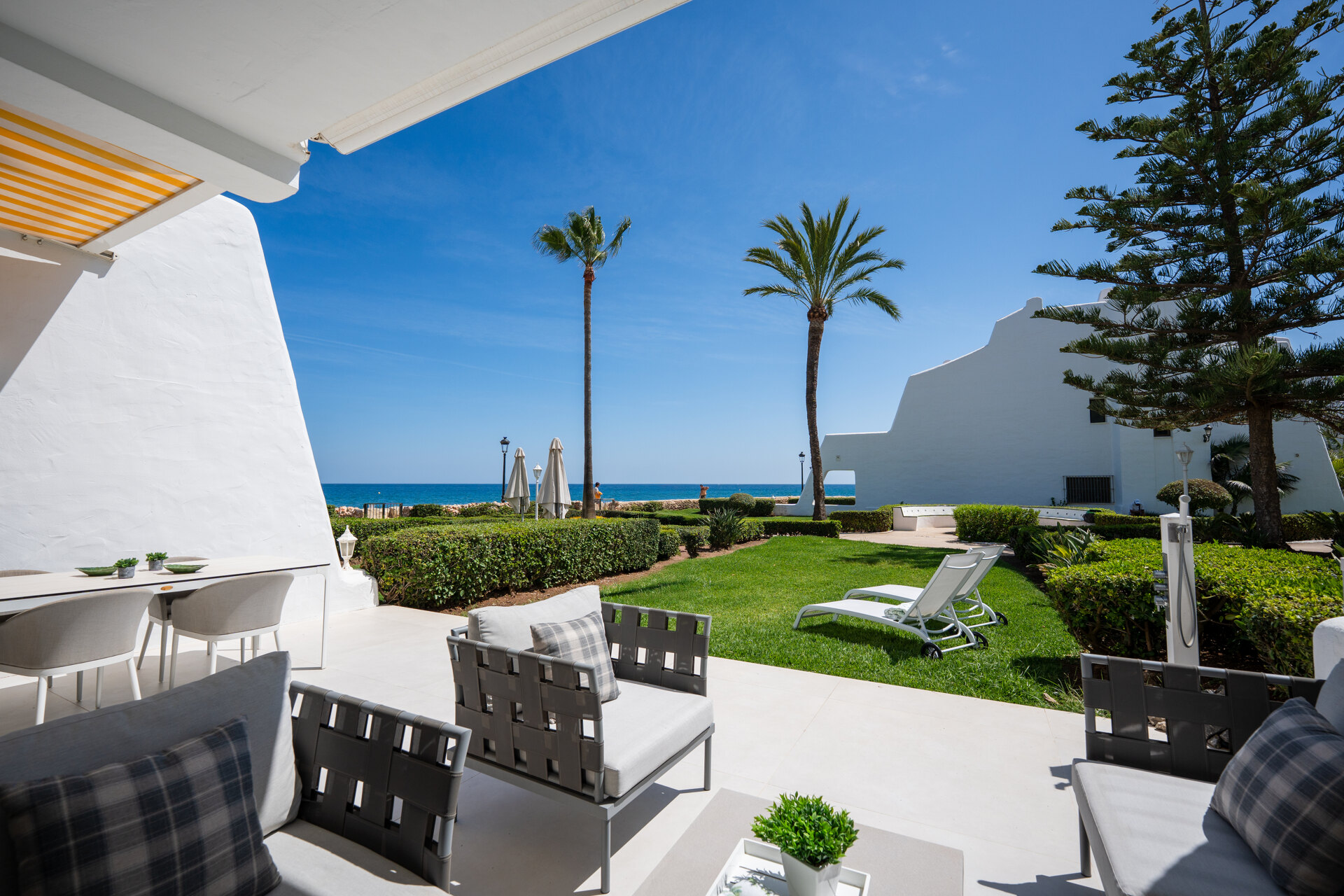 Exceptional beachfront townhouse offers the ultimate coastal lifestyle with uninterrupted sea views