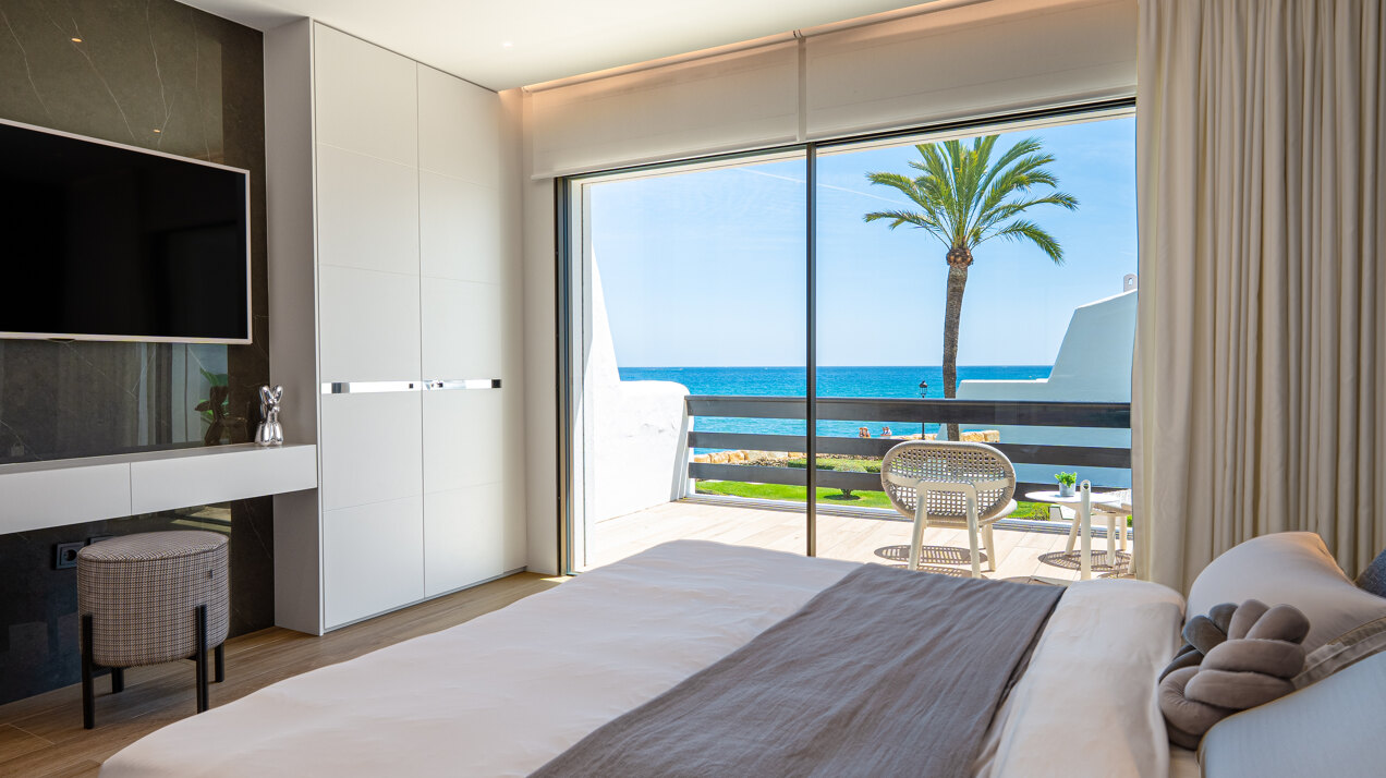 Exceptional beachfront townhouse offers the ultimate coastal lifestyle with uninterrupted sea views