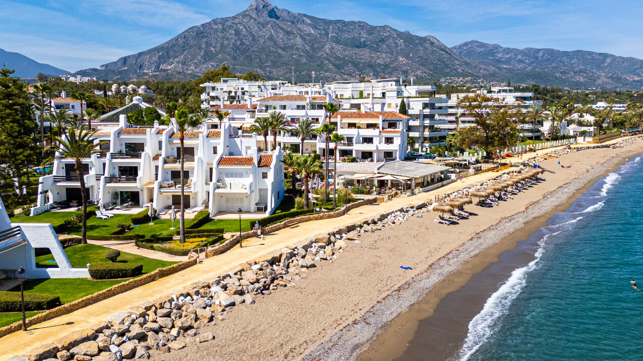 Exceptional beachfront townhouse offers the ultimate coastal lifestyle with uninterrupted sea views