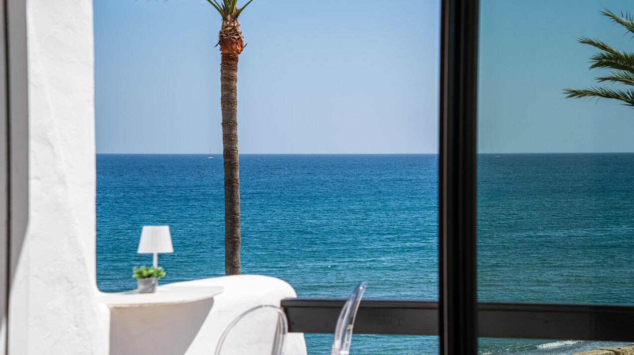 Exceptional beachfront townhouse offers the ultimate coastal lifestyle with uninterrupted sea views
