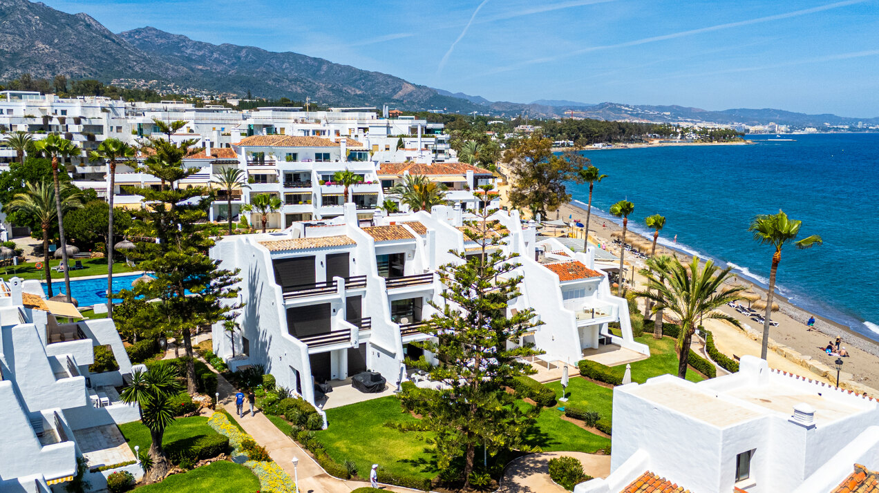 Exceptional beachfront townhouse offers the ultimate coastal lifestyle with uninterrupted sea views