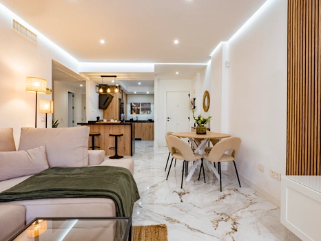 Recently renovated ground floor apartment with private garden in La Reserva de Marbella, front line golf, terrace, and communal pool.