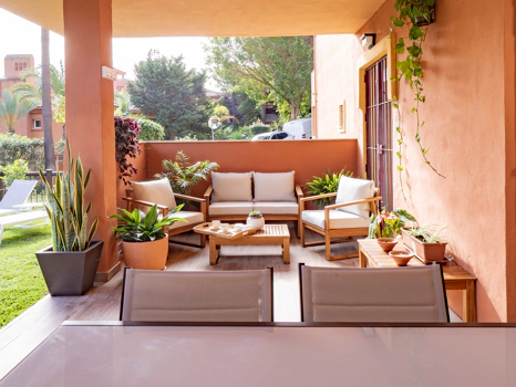 Recently renovated ground floor apartment with private garden in La Reserva de Marbella, front line golf, terrace, and communal pool.