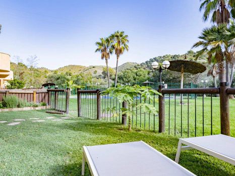 Recently renovated ground floor apartment with private garden in La Reserva de Marbella, front line golf, terrace, and communal pool.