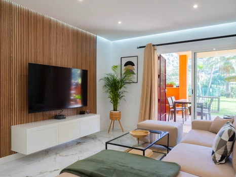 Recently renovated ground floor apartment with private garden in La Reserva de Marbella, front line golf, terrace, and communal pool.