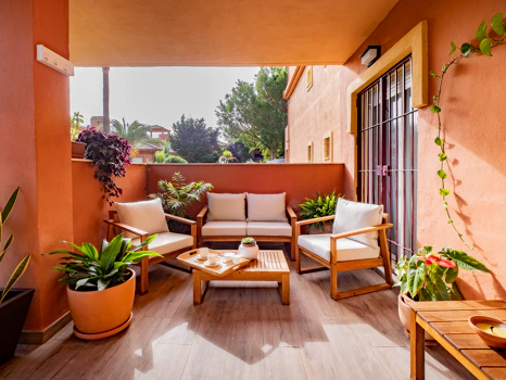 Recently renovated ground floor apartment with private garden in La Reserva de Marbella, front line golf, terrace, and communal pool.