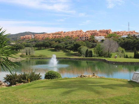 Recently renovated ground floor apartment with private garden in La Reserva de Marbella, front line golf, terrace, and communal pool.