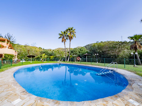Recently renovated ground floor apartment with private garden in La Reserva de Marbella, front line golf, terrace, and communal pool.