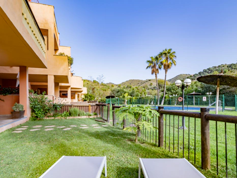 Recently renovated ground floor apartment with private garden in La Reserva de Marbella, front line golf, terrace, and communal pool.