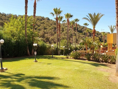 Recently renovated ground floor apartment with private garden in La Reserva de Marbella, front line golf, terrace, and communal pool.