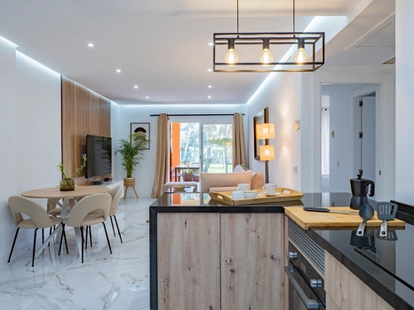 Recently renovated ground floor apartment with private garden in La Reserva de Marbella, front line golf, terrace, and communal pool.