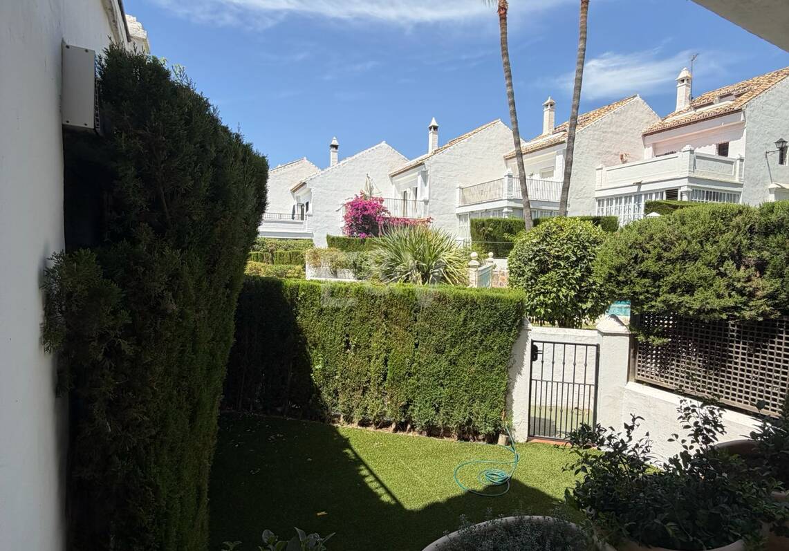 Andalusian charm in Nagüeles, Peaceful Garden Townhouse on Marbella's Golden Mile