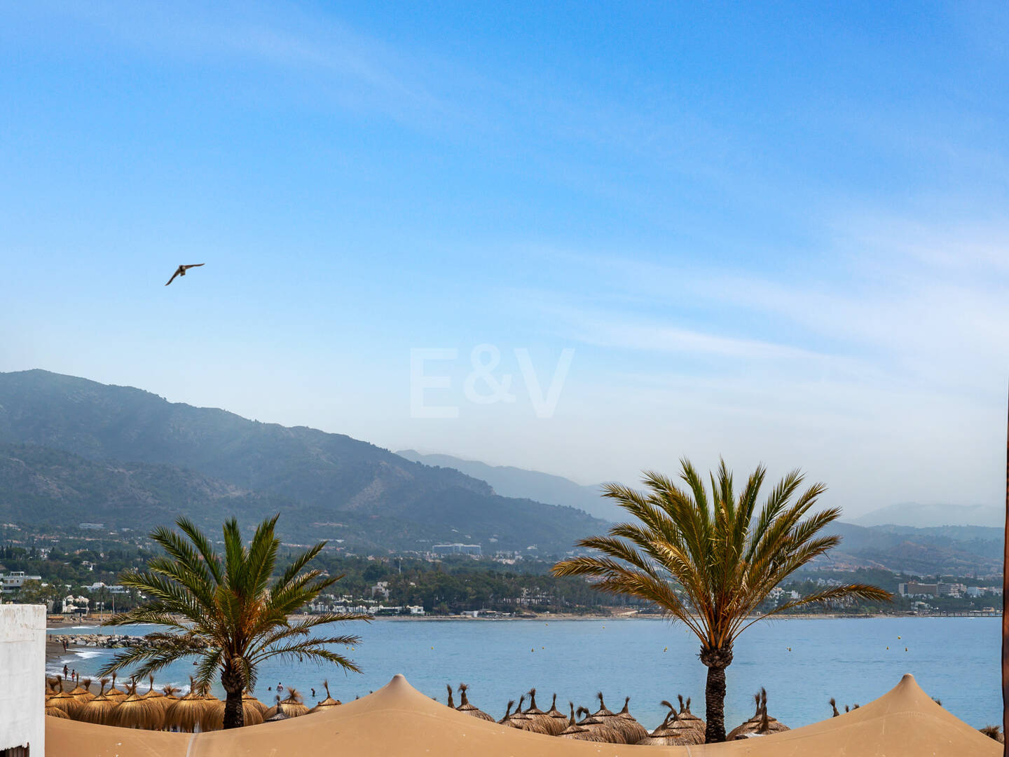 Frontline beach apartment with sea and mountain views