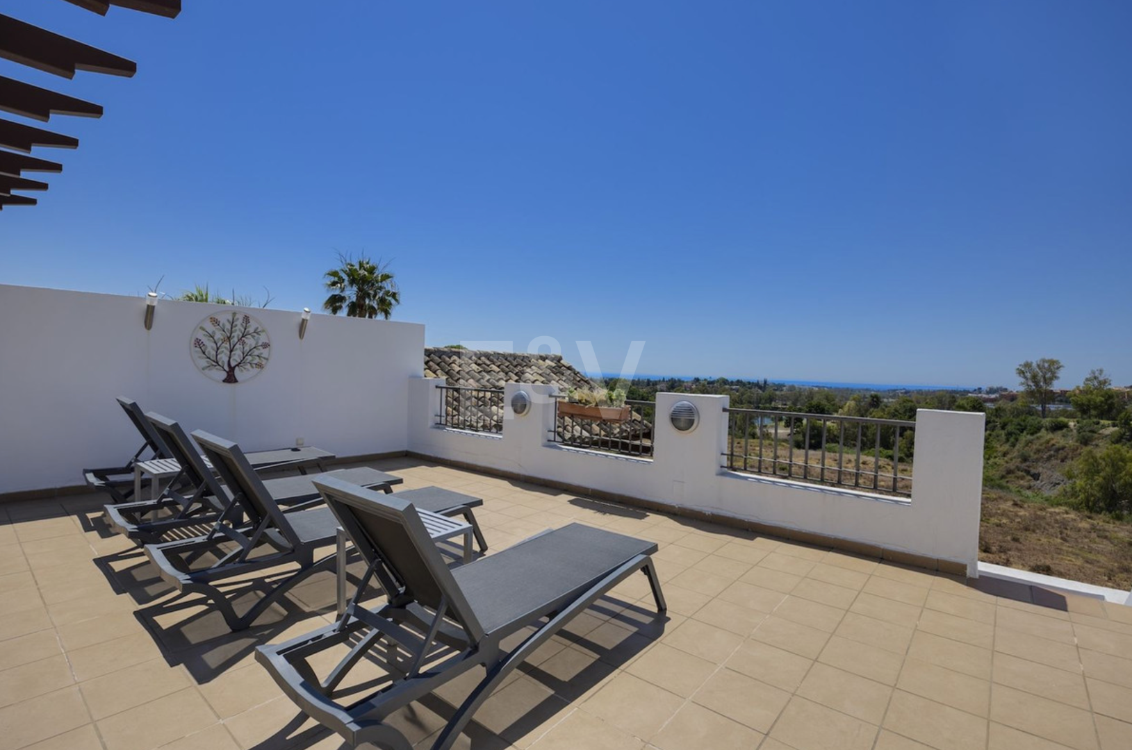 Frontline Golf Penthouse with Expansive Solarium and Sea Views