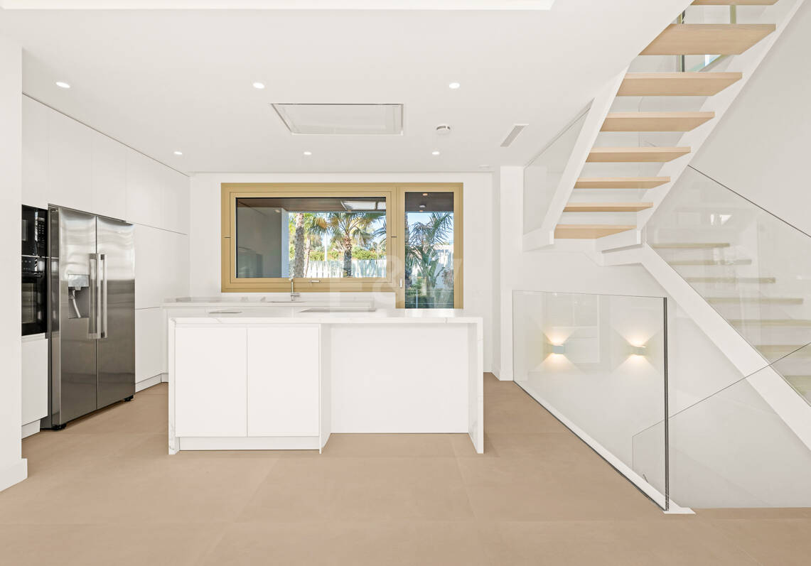 Elegant Triplex Residence with Private Garden and Pool Just Steps from the Beach on the Golden Mile