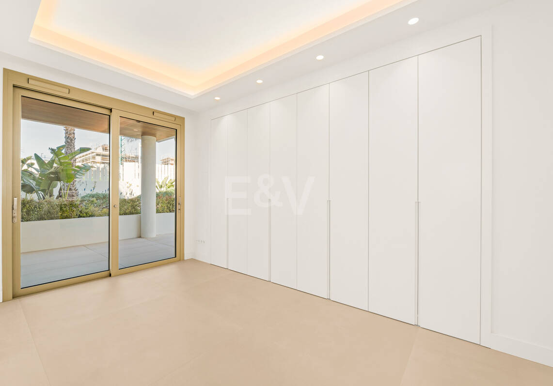 Elegant Triplex Residence with Private Garden and Pool Just Steps from the Beach on the Golden Mile