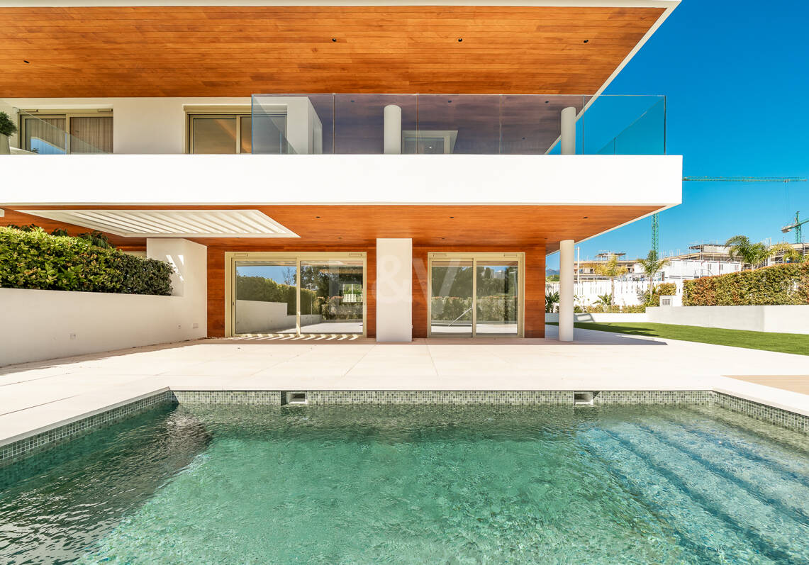 Elegant Triplex Residence with Private Garden and Pool Just Steps from the Beach on the Golden Mile