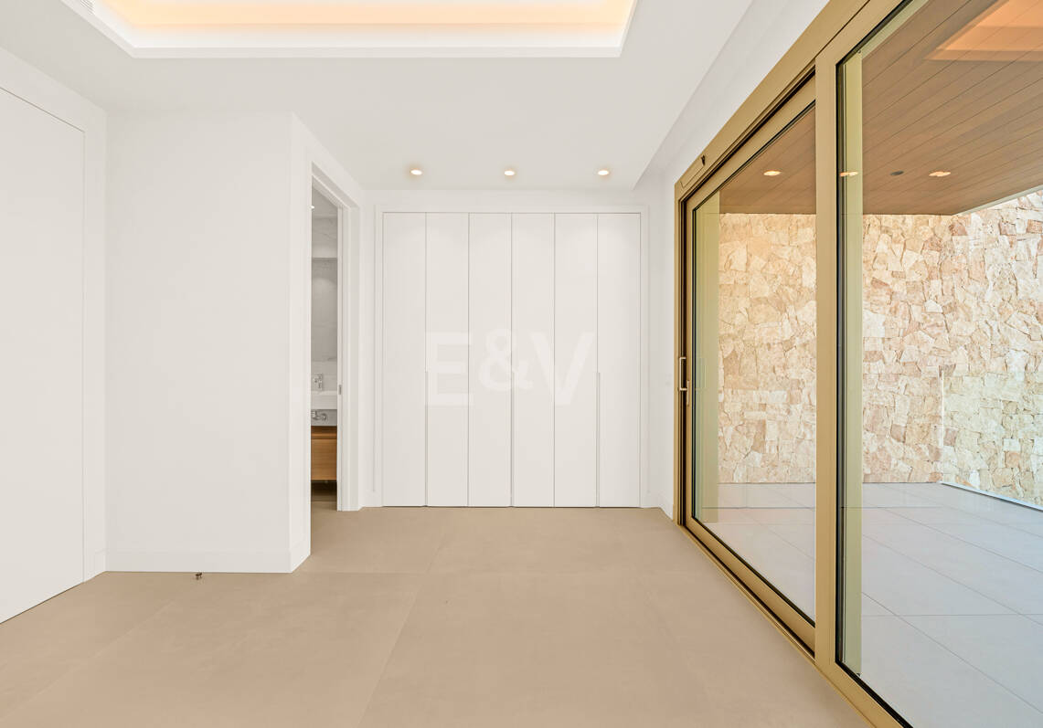 Elegant Triplex Residence with Private Garden and Pool Just Steps from the Beach on the Golden Mile