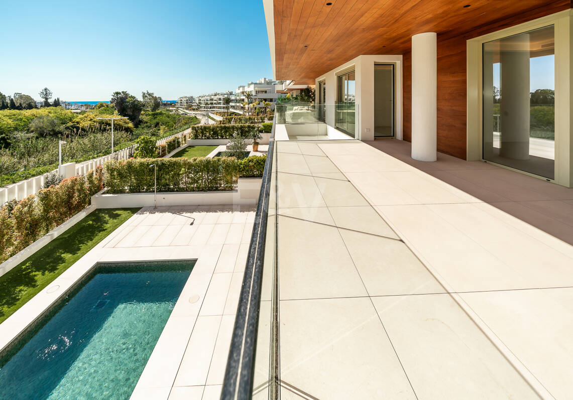 Elegant Triplex Residence with Private Garden and Pool Just Steps from the Beach on the Golden Mile