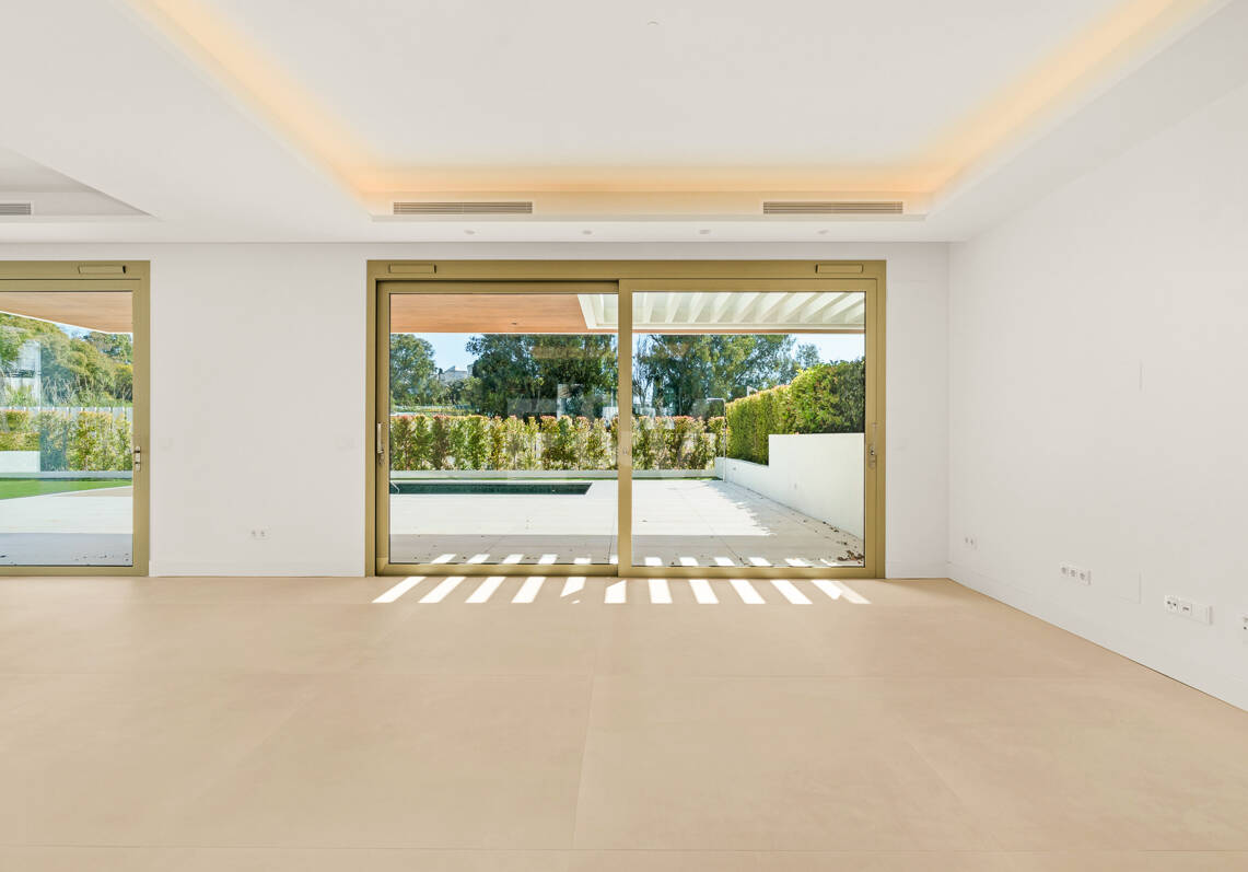 Elegant Triplex Residence with Private Garden and Pool Just Steps from the Beach on the Golden Mile