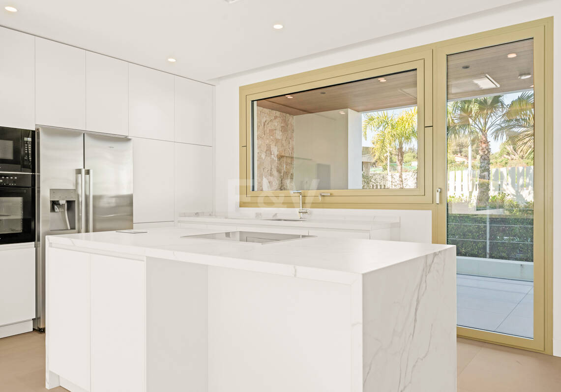 Elegant Triplex Residence with Private Garden and Pool Just Steps from the Beach on the Golden Mile