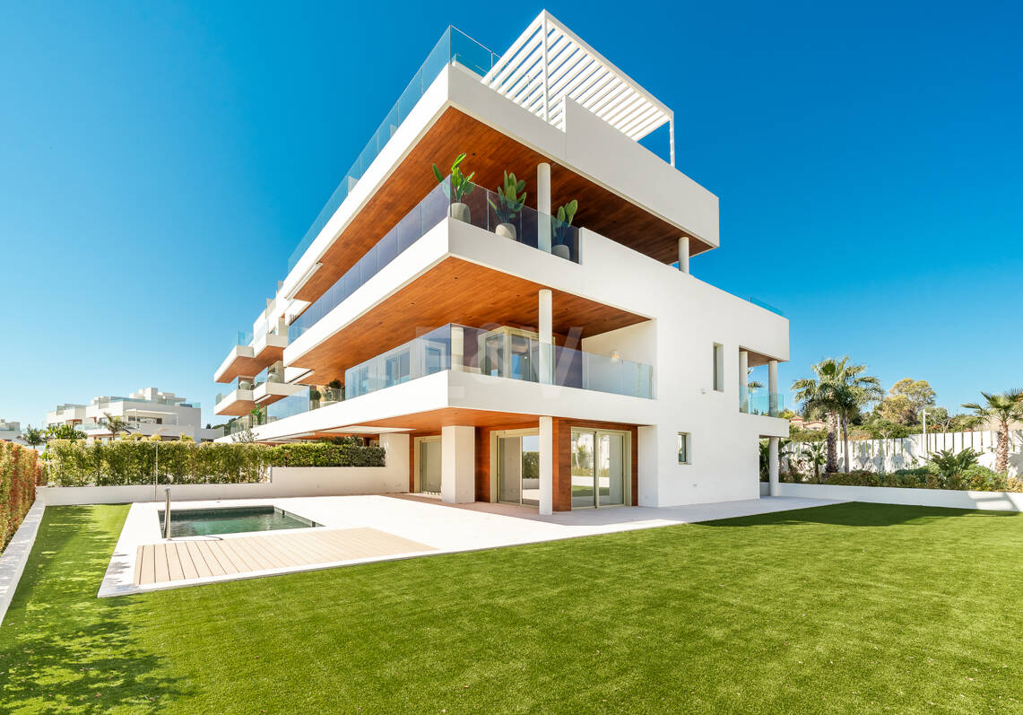 Elegant Triplex Residence with Private Garden and Pool Just Steps from the Beach on the Golden Mile