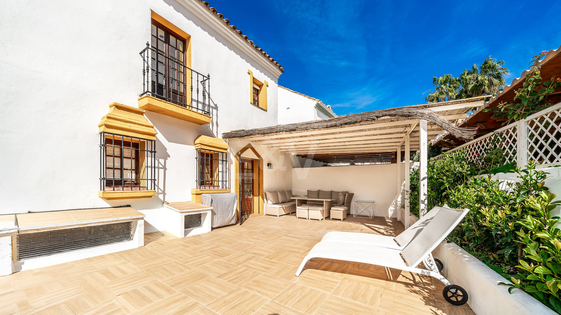 Refined Andalusian Townhouse Steps from the Beach in an Exclusive Setting
