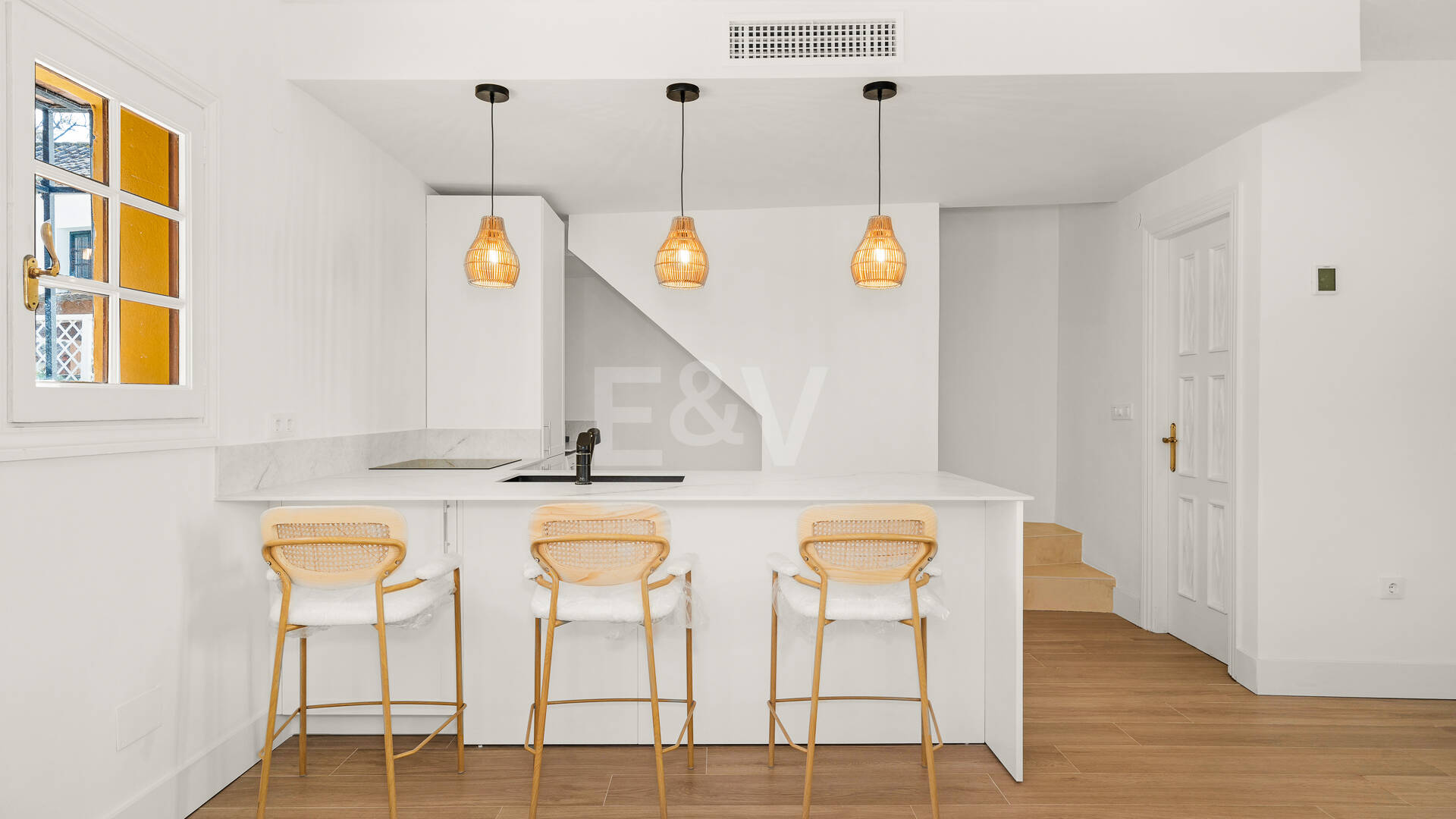 Refined Andalusian Townhouse Steps from the Beach in an Exclusive Setting