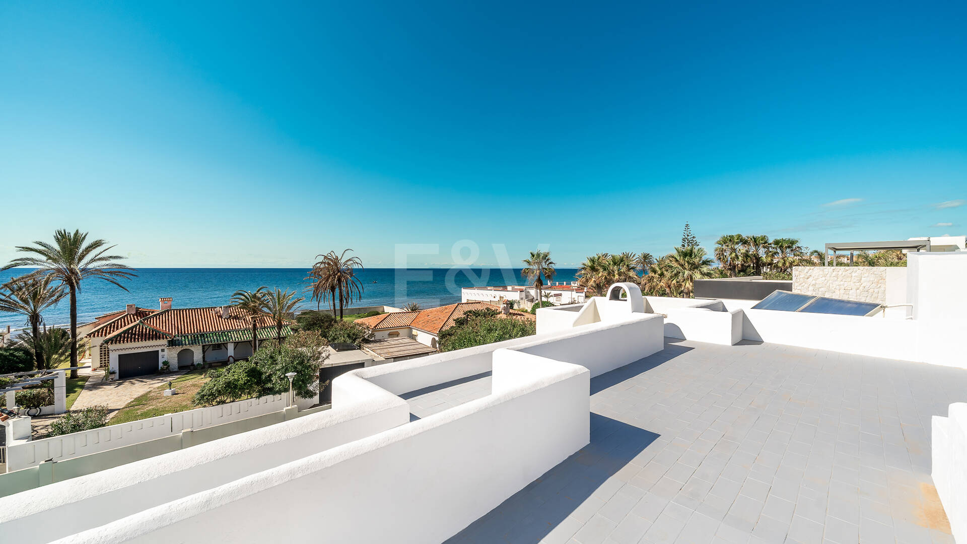 Contemporary Beachside Villa Just Steps from the Sea with Panoramic Views