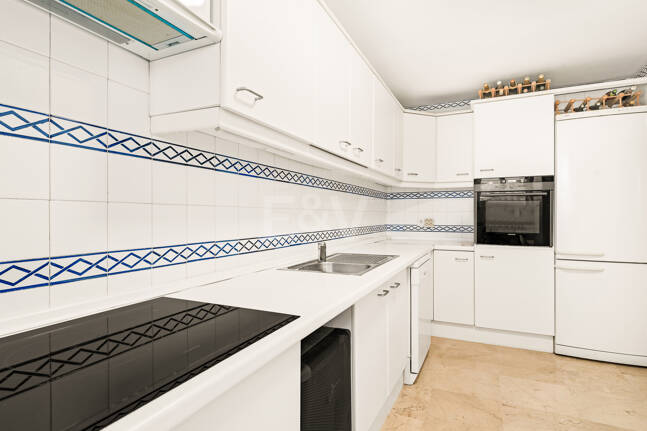 Elegant Frontline Golf Apartment with Expansive Terrace