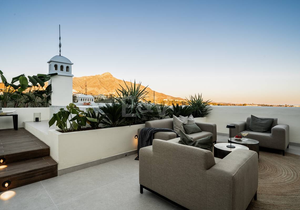 Elegant duplex penthouse in La Cerquilla with spectacular mountain views